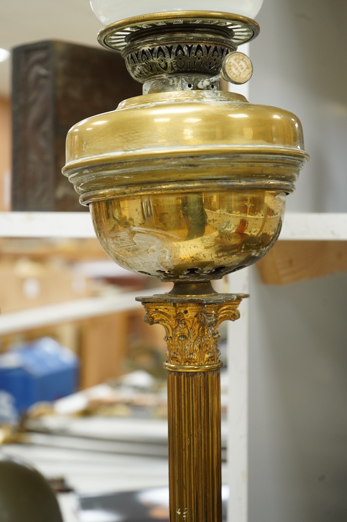 An Edwardian Corinthian column oil lamp, 72 high not including chimney
